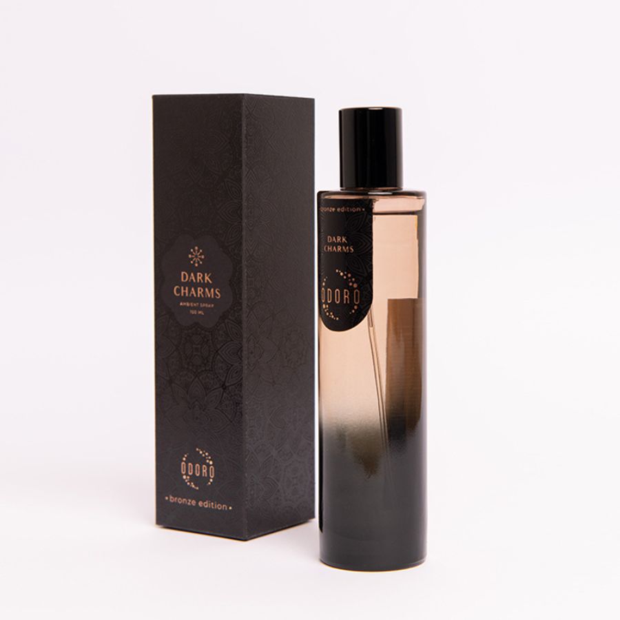 DARK CHARMS spray fragrance bottle alongside its luxurious packaging box on a white background, showcasing the elegant design of both from the side