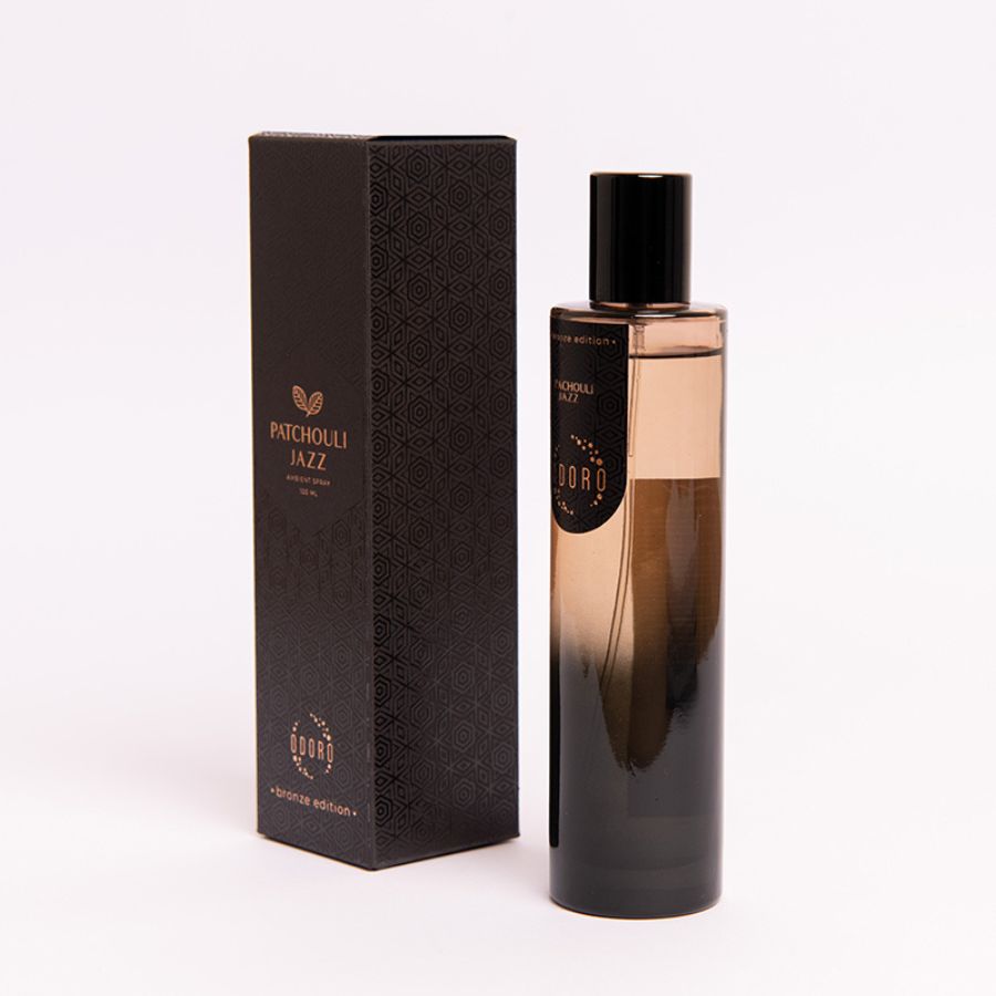 Patchouli jazz spray fragrance bottle alongside its luxurious packaging box on a white background, showcasing the elegant design of both.