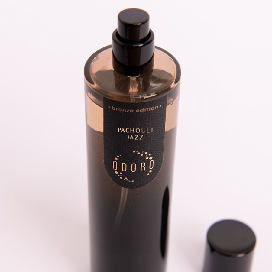 Open Pachouli jazz fragrance bottle on a white background, highlighting its luxurious scent and elegant design.