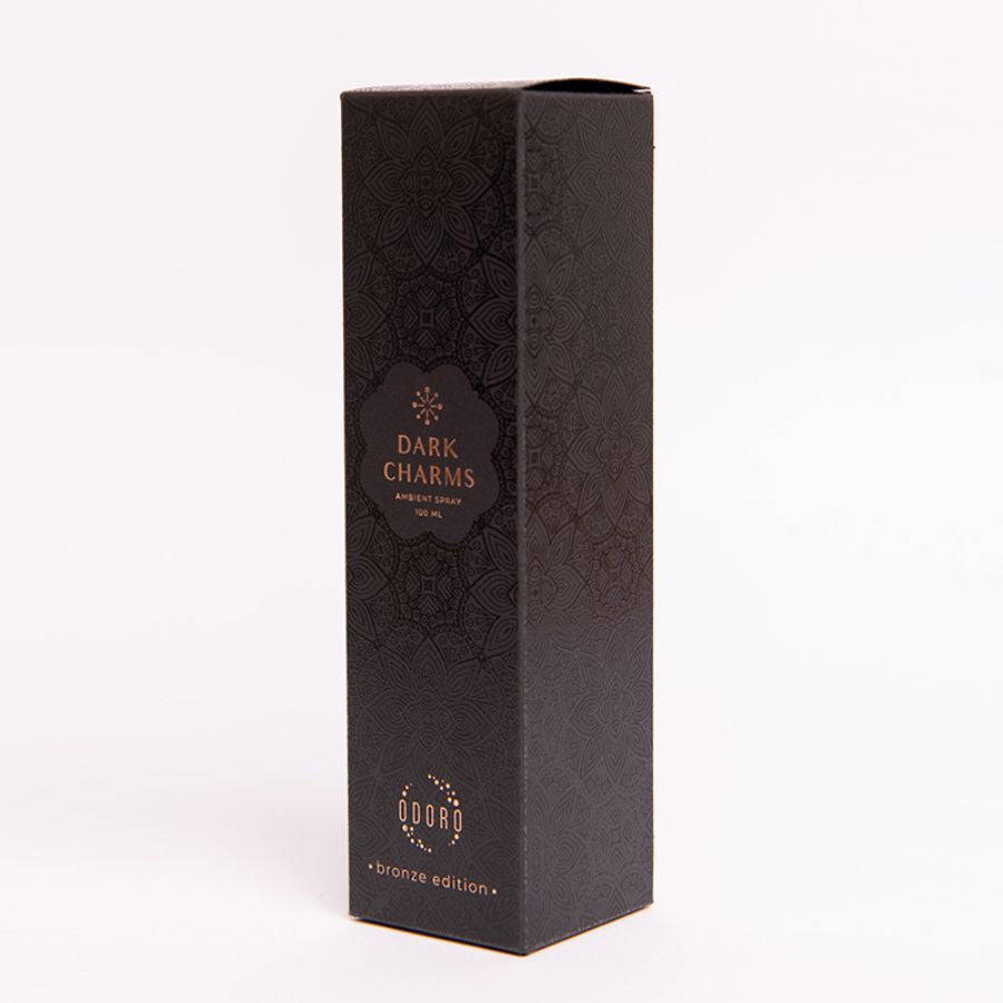 Luxurious cardboard packaging box of DARK CHARMS spray fragrance on a white background, highlighting its elegant design and premium quality.