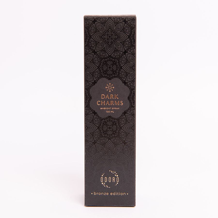 Luxurious cardboard packaging box of DARK CHARMS spray fragrance on a white background, highlighting its elegant design and premium quality.