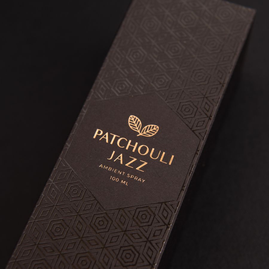 Close-up of Patchouli jazz luxurious packaging box on a sleek black background, emphasizing its elegant design and premium quality.