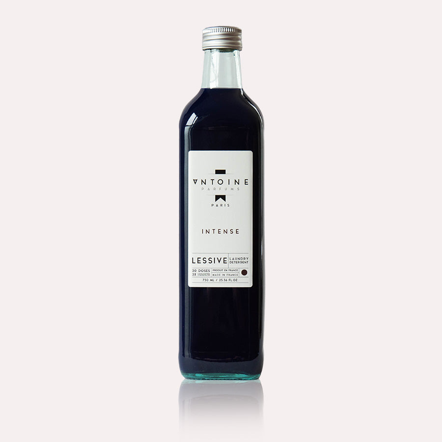 Antoine Intense perfumed laundry detergent in a recyclable glass bottle, offering an intense, long-lasting fragrance.