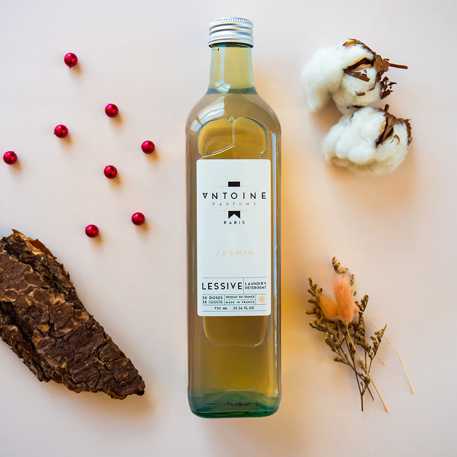 Antoine Jasmin perfumed laundry detergent in a recyclable glass bottle, showcasing its elegant design and premium fragrance.