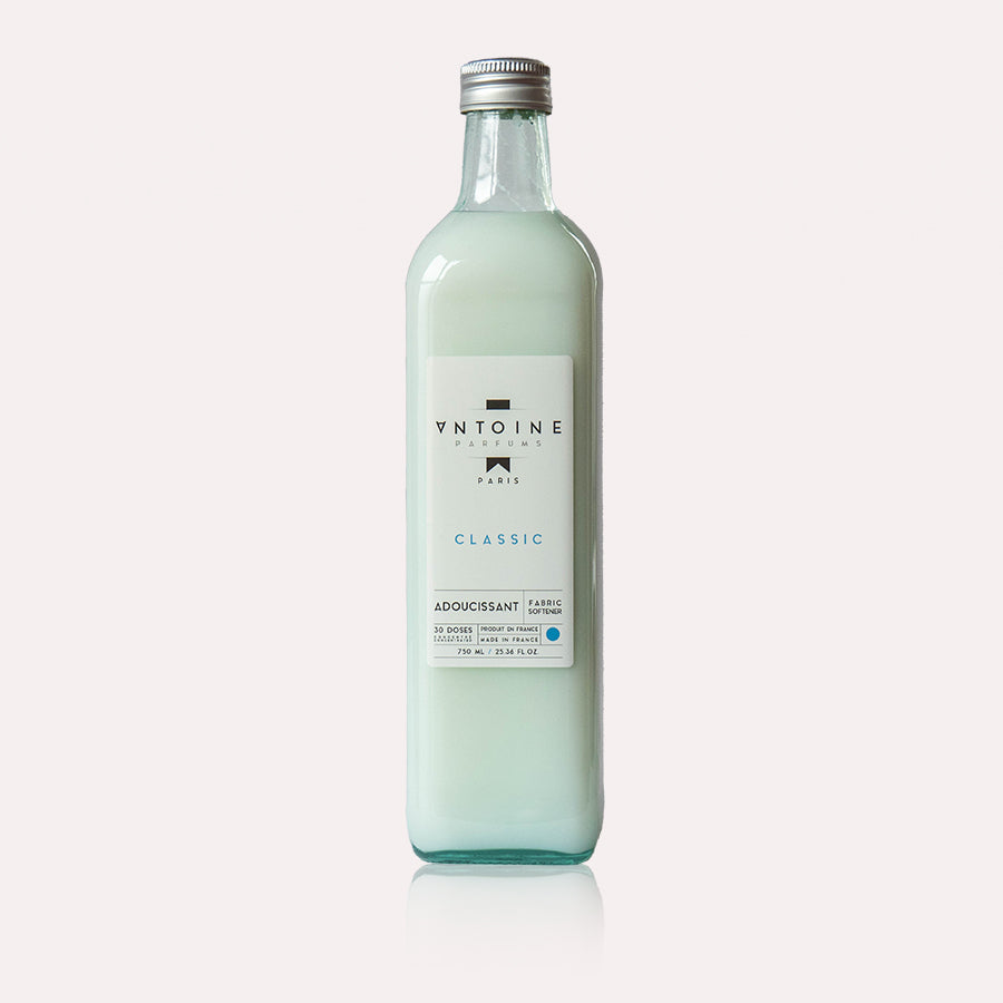 Antoine Classic fabric softener in a minimalist glass bottle, emphasizing the clean and refined design.