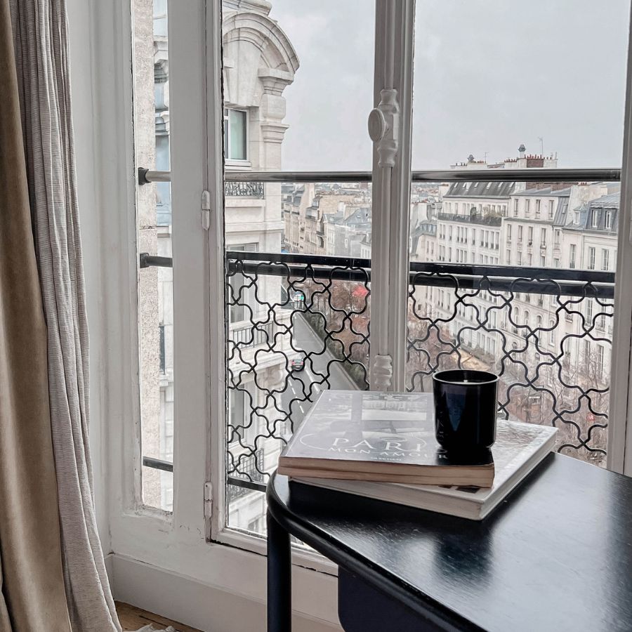 Cuban Soul scented candle on a cozy balcony, overlooking a Parisian street