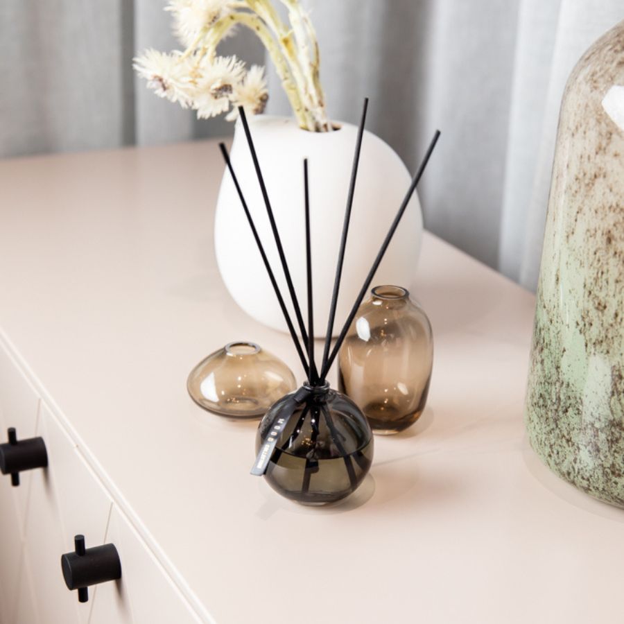 Mood Collection Gentleman reed diffuser placed on a modern interior decor setup with stylish accents.