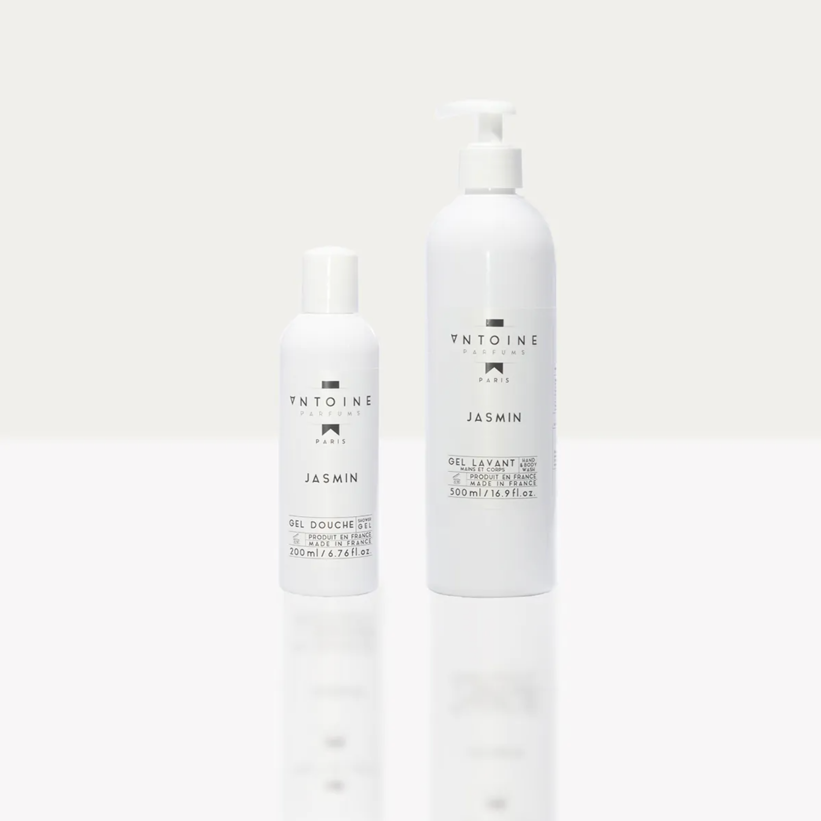 Antoine Parfums “Jasmine” Hand & Body Wash minimalist white bottles standing on light background — luxury floral shower gel from France
