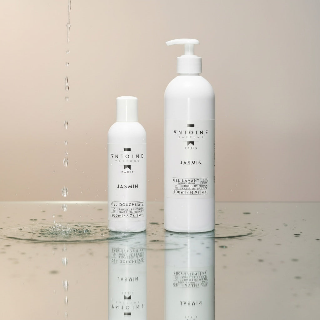Antoine Parfums “Jasmine” Hand & Body Wash bottles with water drops on reflective surface — elegant floral French body wash with jasmine scent