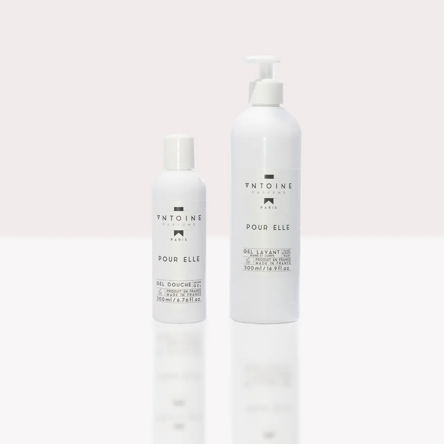 Antoine Parfums “Pour Elle” Hand & Body Wash minimalist white bottles standing side by side on light background