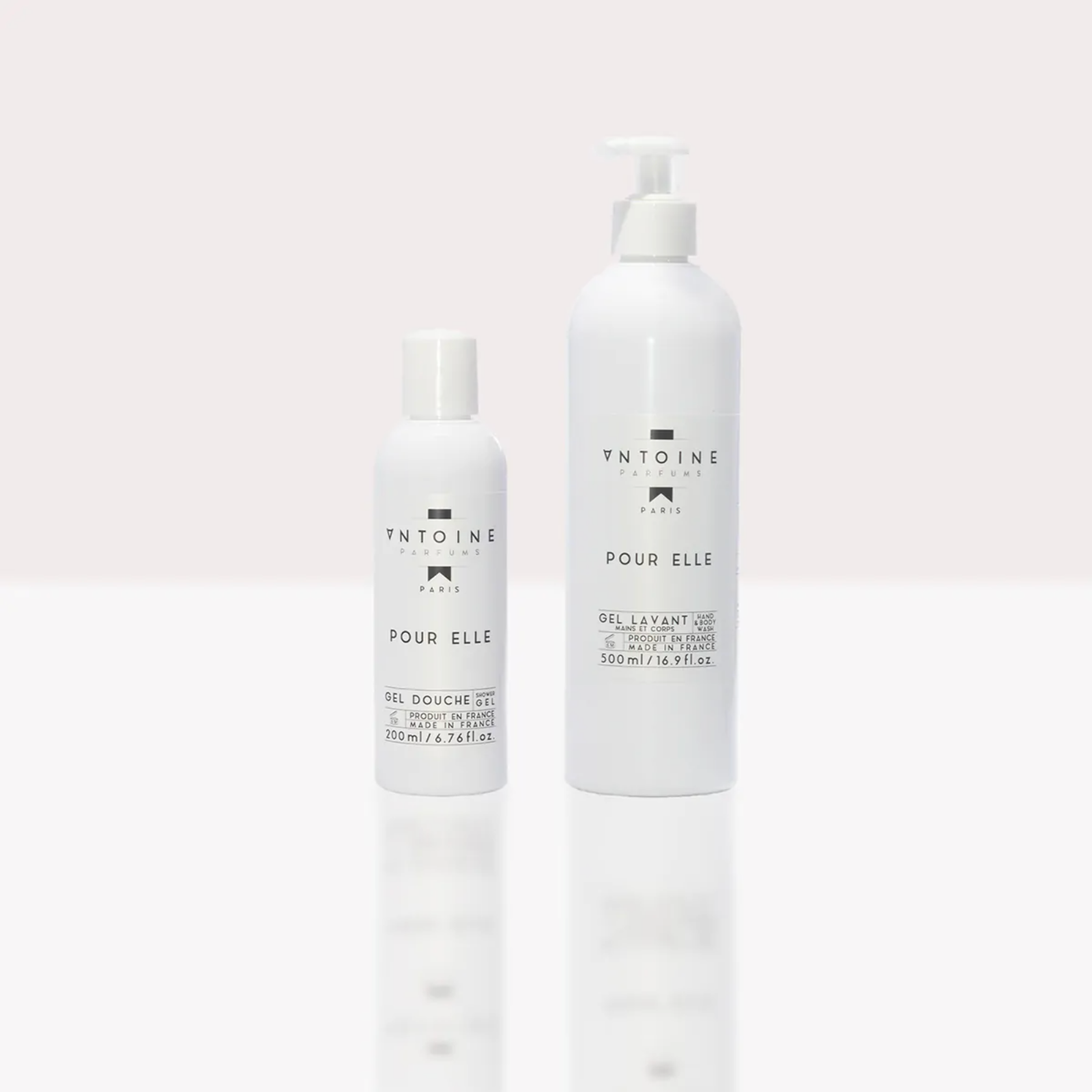Antoine Parfums “Pour Elle” Hand & Body Wash minimalist white bottles standing side by side on light background