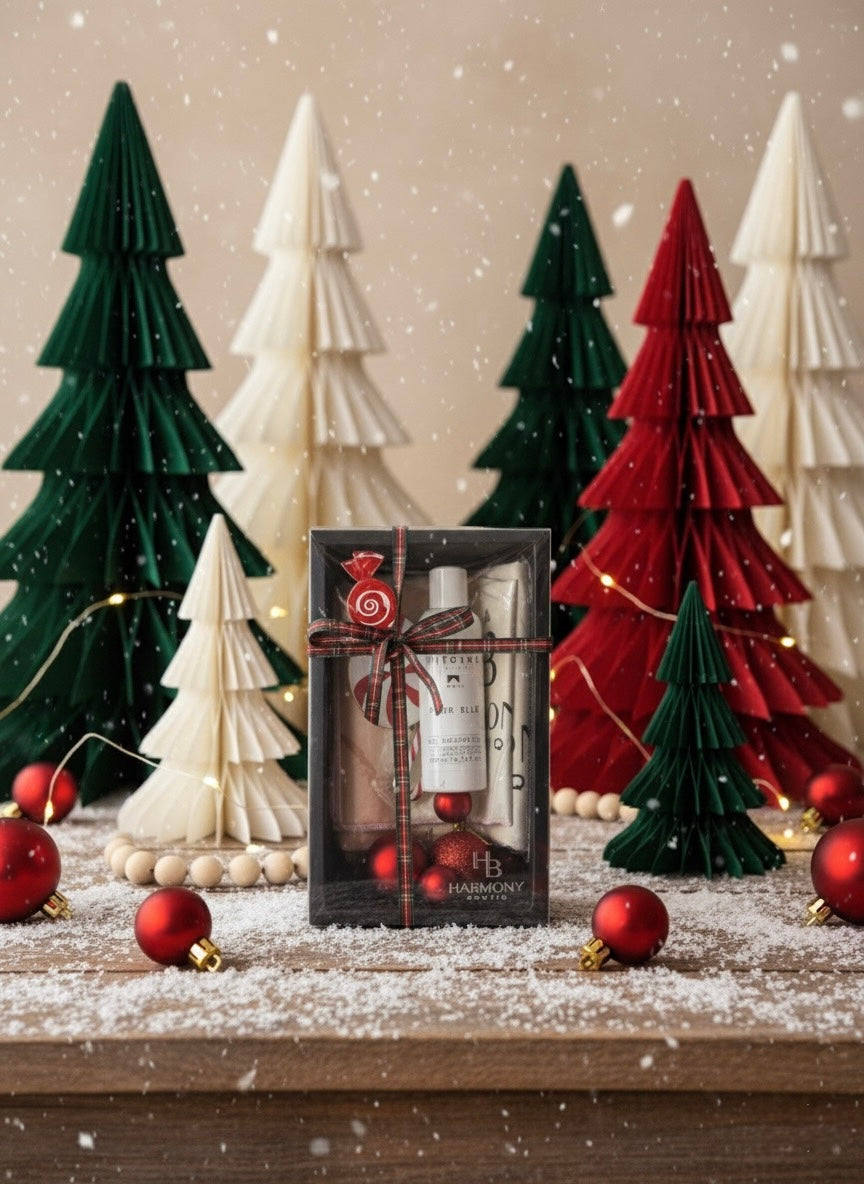 Harmony Boutiq Pour Elle gift set with perfumed shower gel and Rosé Vein microfiber towel set, elegant holiday background with Christmas decorations.