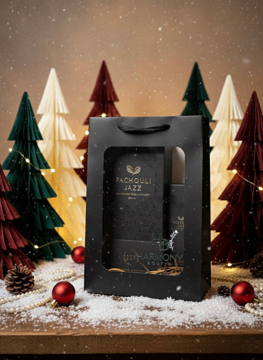 Harmony Boutiq Pachouli Jazz home fragrance gift set with reed diffuser and room spray, placed on a festive background with Christmas decorations.