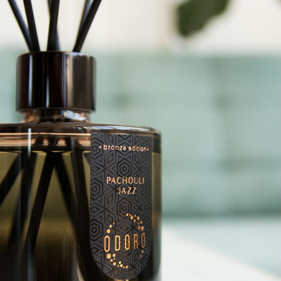 brown home fragrance bottle featuring the Patchouli jazz label, highlighting its elegant design and rich color against blured background