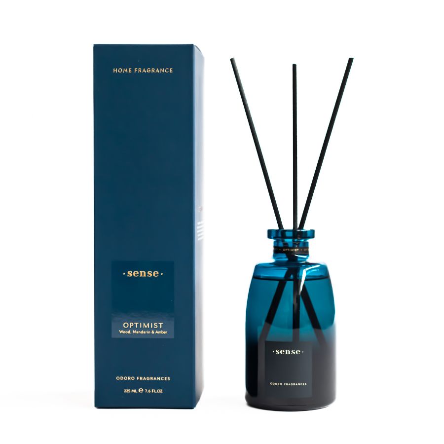 ODORO Sense Optimist diffuser alongside its sleek blue packaging, set against a clean white background, showcasing its modern design and premium fragrance offering.