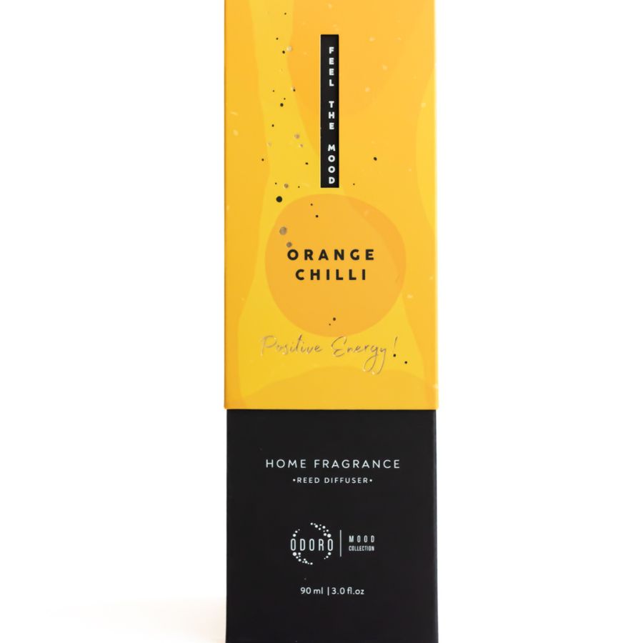 Front view of Orange Chilli reed diffuser with bright yellow packaging, designed for positive energy.